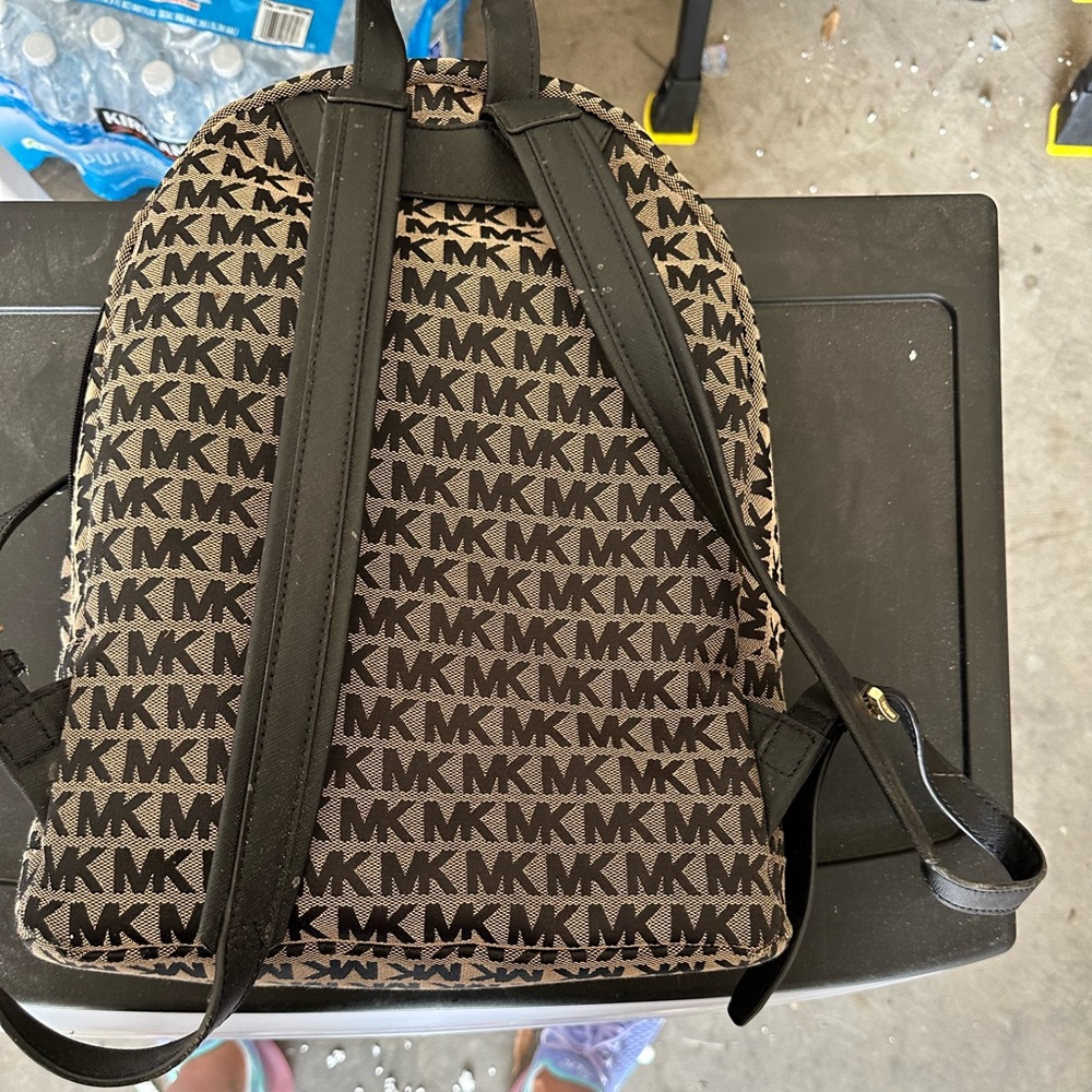Like New: Michael Kors Backpack…color- black and tan
